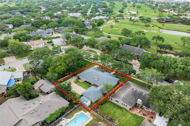 birds eye view of property with golf course view, a residential view, and a water view