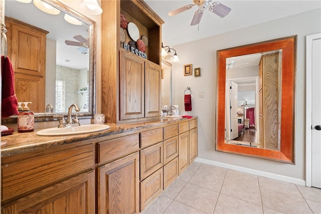 full bath featuring a sink, tile patterned flooring, ceiling fan, and double vanity