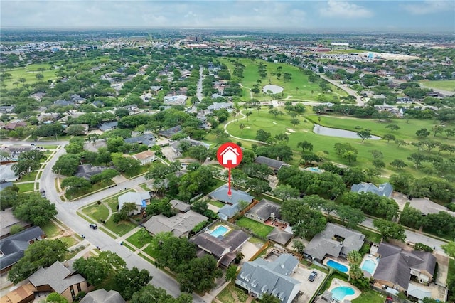 bird's eye view with a residential view, a water view, and view of golf course