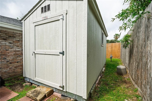 view of shed with fence