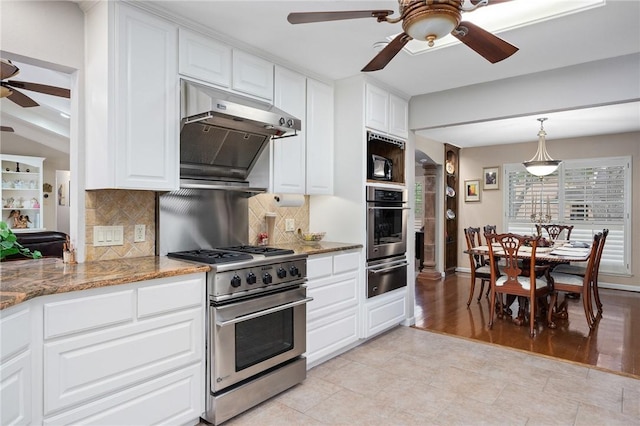 kitchen with white cabinetry, tasteful backsplash, appliances with stainless steel finishes, ceiling fan, and a warming drawer