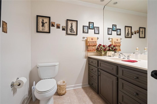 half bath with crown molding, baseboards, toilet, tile patterned floors, and vanity