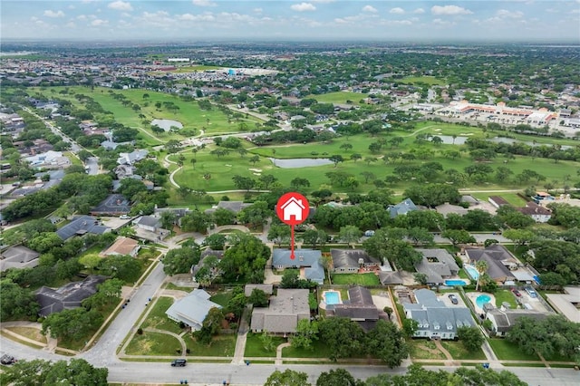 birds eye view of property featuring golf course view, a residential view, and a water view