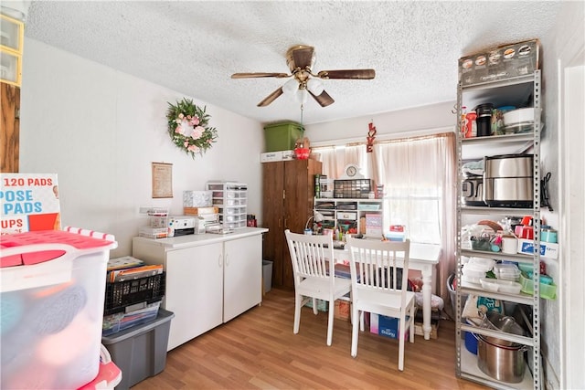 117 Doyle Dr, Portland, TX 78374 - dining area with a ceiling fan, a textured ceiling, light wood finished floors, and washer / clothes dryer