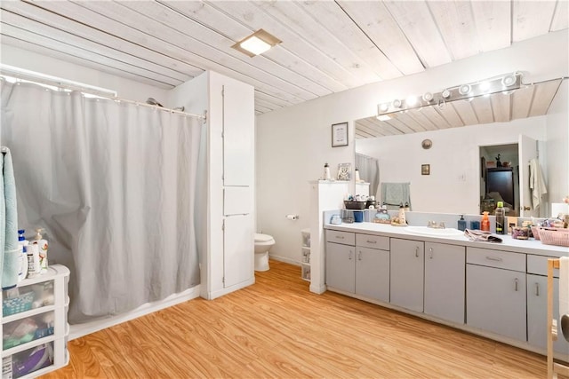 117 Doyle Dr, Portland, TX 78374 - bathroom featuring vanity, toilet, wood finished floors, a shower with curtain, and wood ceiling