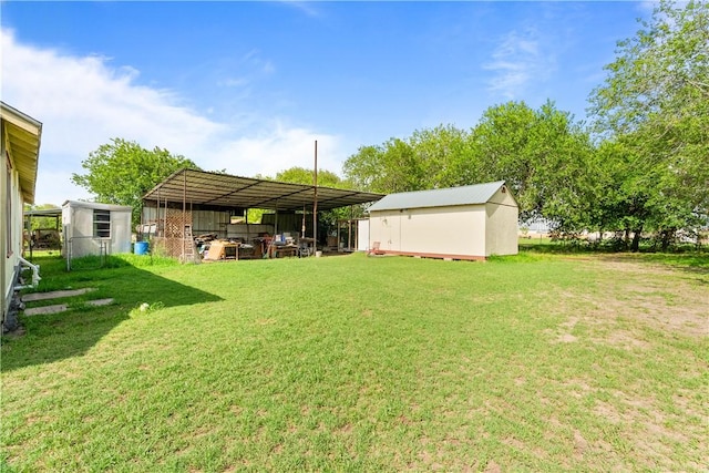 117 Doyle Dr, Portland, TX 78374 - view of green lawn with an outdoor structure and a pole building