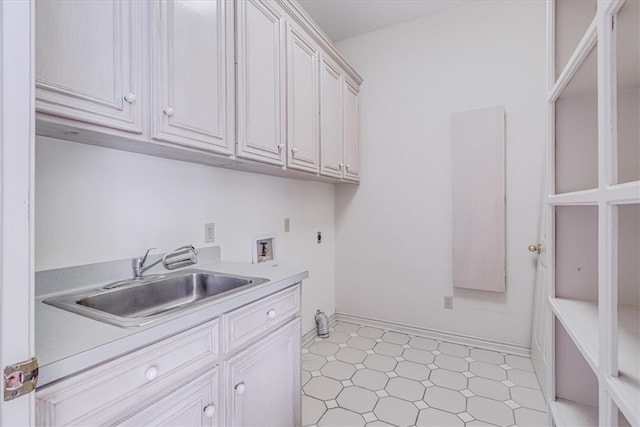 clothes washing area with electric dryer hookup, washer hookup, cabinets, and sink