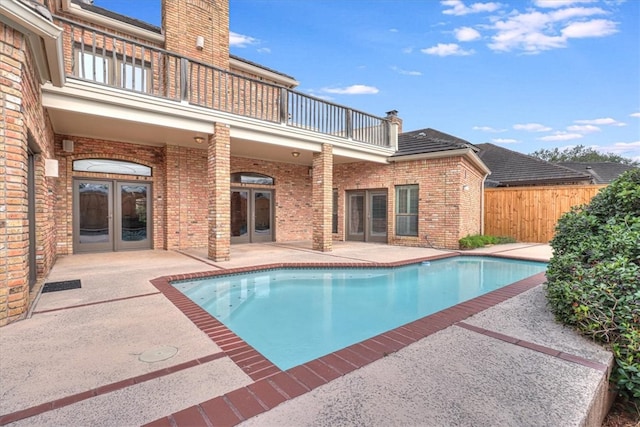 view of pool with a patio area and french doors