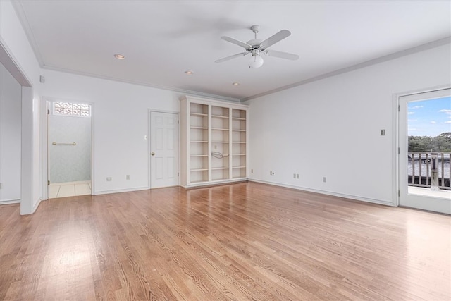 unfurnished room featuring light wood-type flooring, ceiling fan, and crown molding