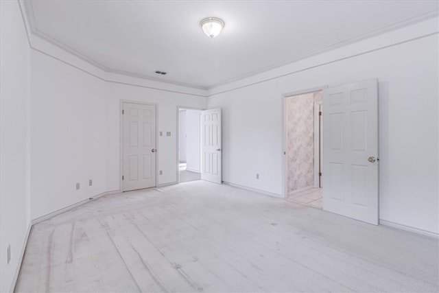 spare room with light carpet and ornamental molding