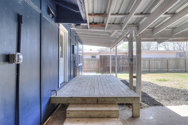 wooden terrace featuring fence