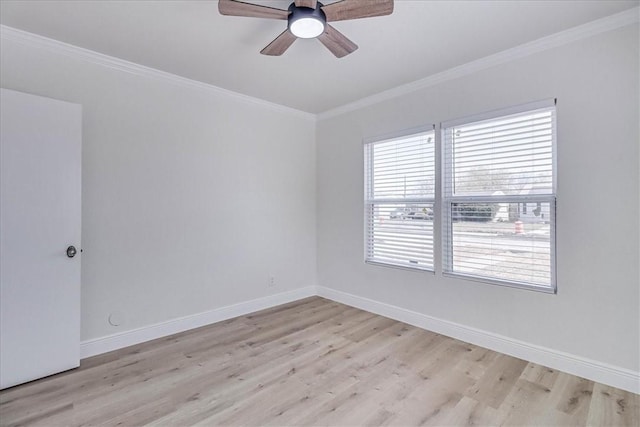 empty room with light wood finished floors, a ceiling fan, baseboards, and ornamental molding