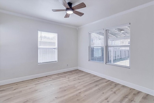 empty room featuring crown molding, baseboards, light wood finished floors, and ceiling fan