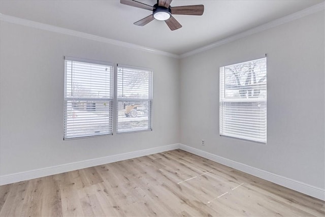 unfurnished room featuring light wood-type flooring, baseboards, and ornamental molding