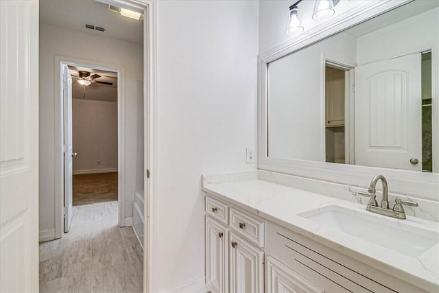 bathroom featuring vanity and hardwood / wood-style flooring