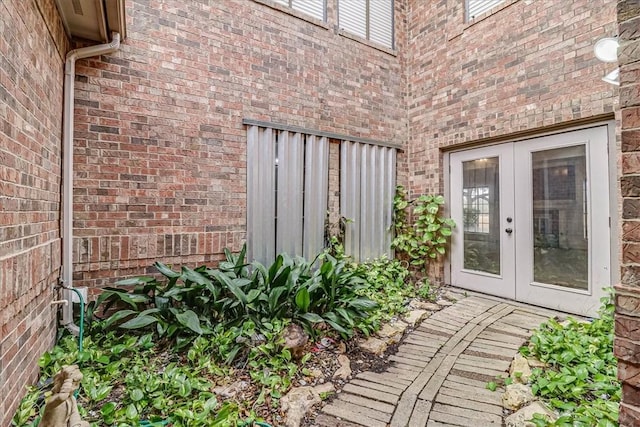 view of exterior entry featuring french doors