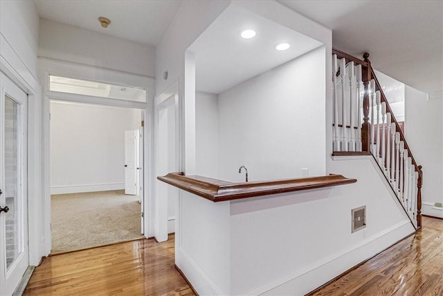 hall with light wood-type flooring