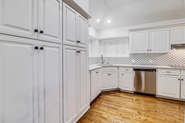 kitchen with white cabinetry, dishwasher, sink, and light hardwood / wood-style flooring