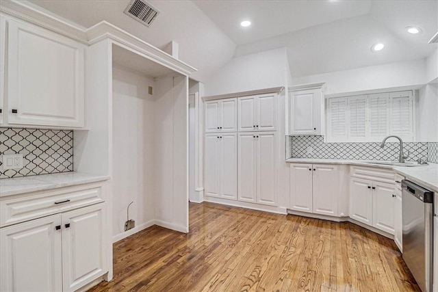 kitchen with dishwasher, sink, light hardwood / wood-style flooring, and white cabinets