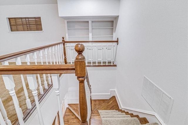 stairs with hardwood / wood-style flooring