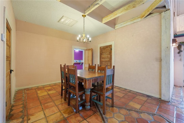 dining area with a textured ceiling and a notable chandelier