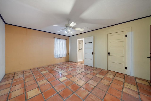 interior space with ceiling fan and crown molding