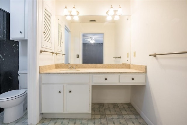 bathroom with vanity and toilet