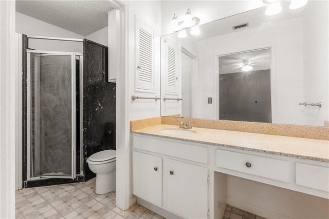 41 Townhouse, Corpus Christi, TX 78412 - bathroom featuring a shower stall, vanity, toilet, a textured ceiling, and ceiling fan