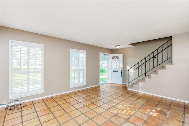 41 Townhouse, Corpus Christi, TX 78412 - entryway with stairway, baseboards, and tile patterned flooring