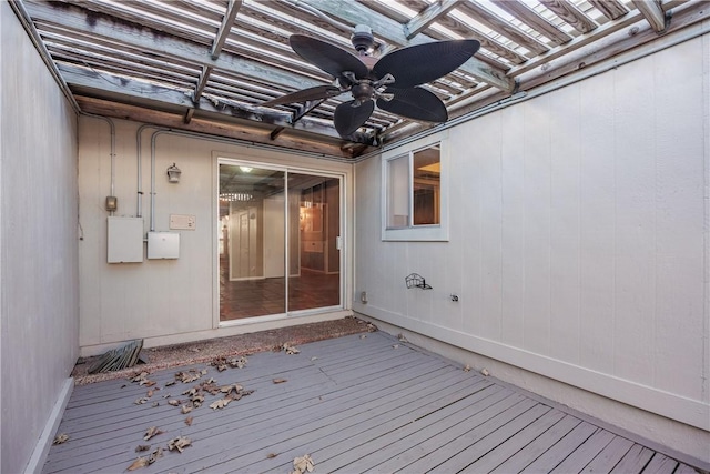 wooden deck featuring ceiling fan