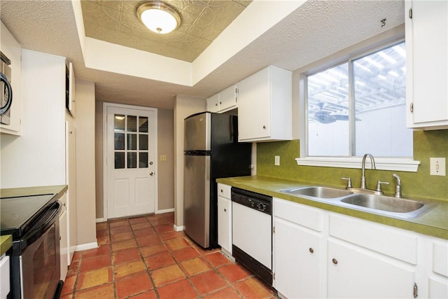 kitchen with white dishwasher, white cabinets, sink, electric range, and stainless steel fridge