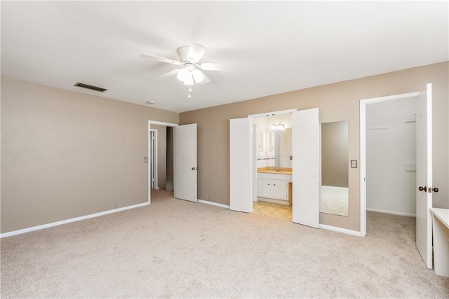41 Townhouse, Corpus Christi, TX 78412 - unfurnished bedroom featuring light carpet, a spacious closet, and baseboards