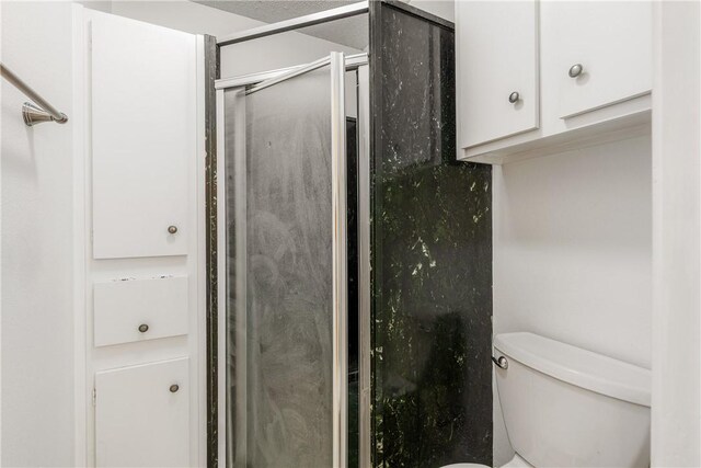 41 Townhouse, Corpus Christi, TX 78412 - bathroom featuring toilet and an enclosed shower
