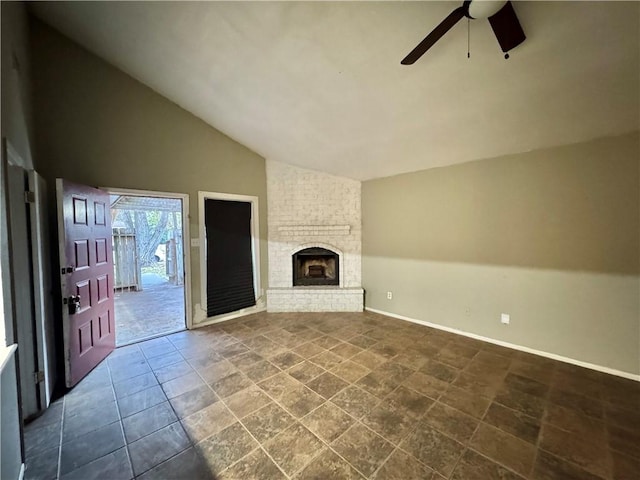 unfurnished living room with a brick fireplace, ceiling fan, and lofted ceiling