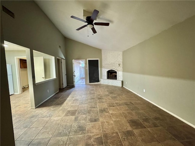 unfurnished living room with ceiling fan, a fireplace, and lofted ceiling