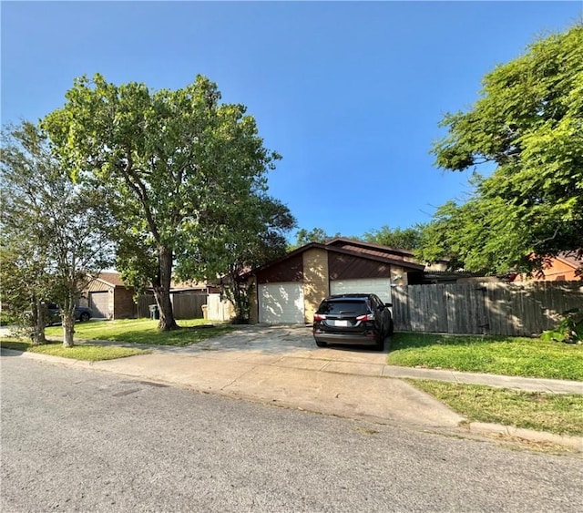 view of front of property with an outdoor structure and a garage