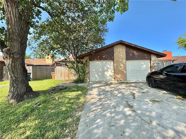 view of property exterior featuring a garage, an outdoor structure, and a lawn