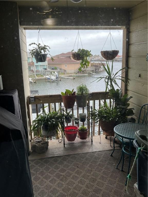 balcony featuring a water view
