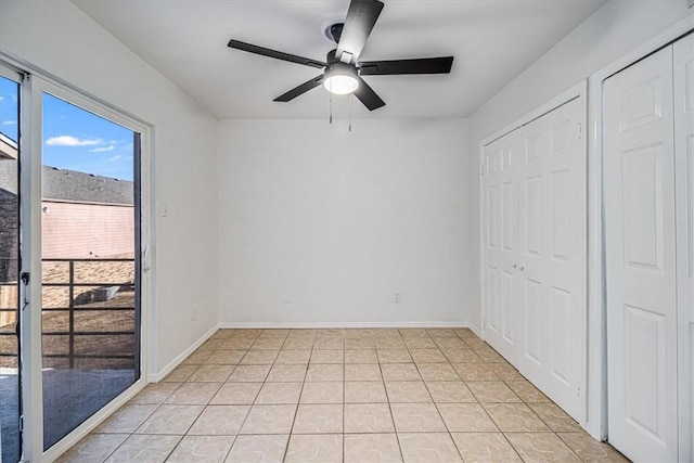 interior space featuring light tile patterned floors and ceiling fan