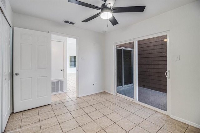 interior space featuring light tile patterned floors, a closet, and ceiling fan