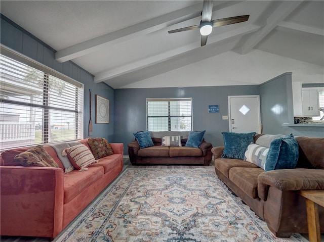 living room featuring ceiling fan and lofted ceiling with beams