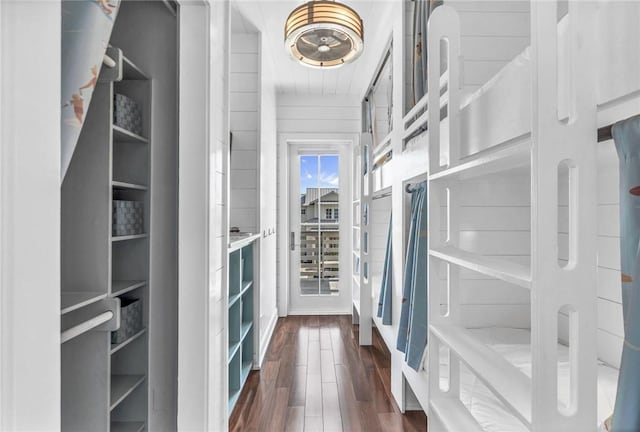 spacious closet with dark wood-type flooring