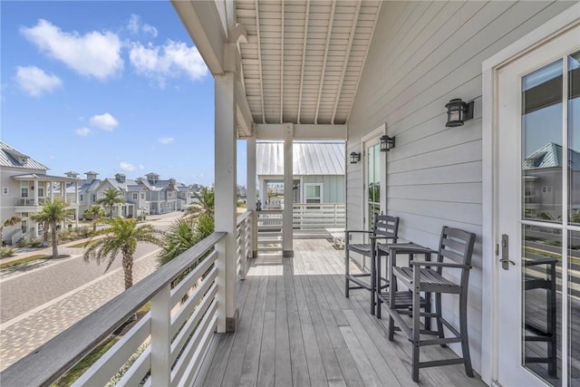 wooden terrace with a residential view