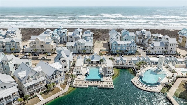 birds eye view of property with a water view and a residential view