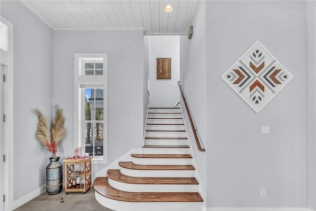 stairs with wooden ceiling and baseboards