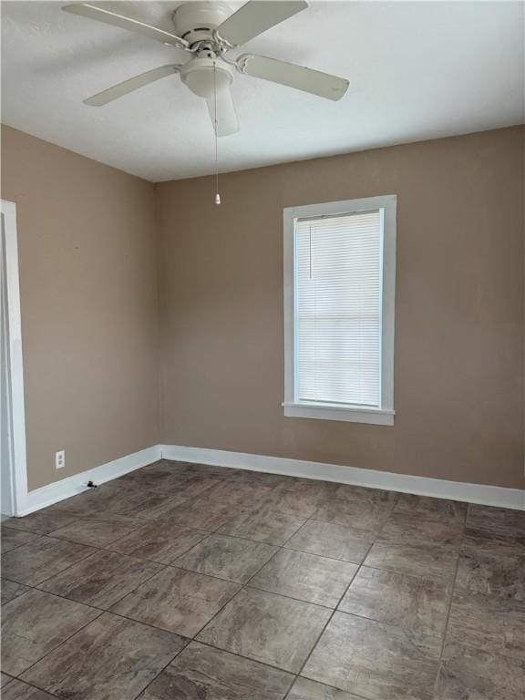 empty room featuring ceiling fan