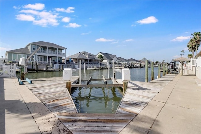 637 Pompano Dr, Aransas Pass, TX 78336 - dock area with boat lift, a water view, and a residential view