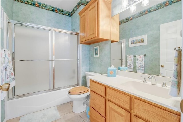637 Pompano Dr, Aransas Pass, TX 78336 - bathroom with tile patterned flooring, vanity, and shower / bath combination with glass door
