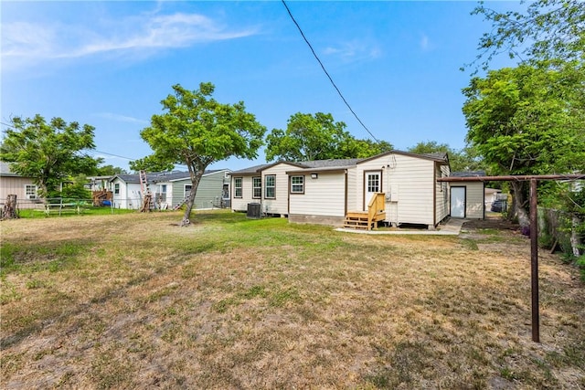 1336 Brentwood Dr, Corpus Christi, TX 78415 - rear view of house with entry steps and central air condition unit