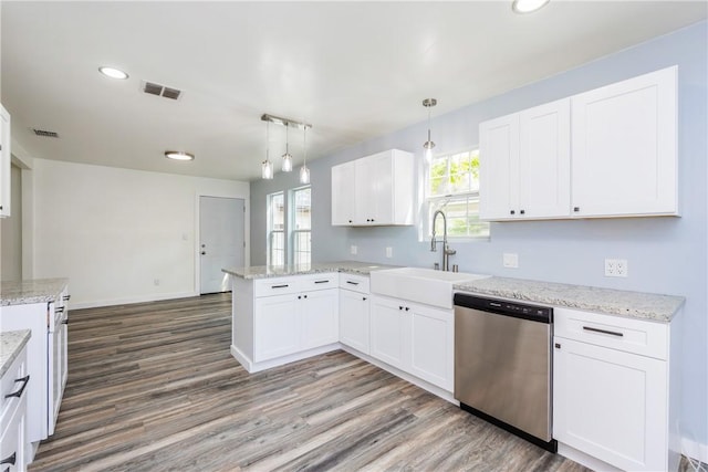 1336 Brentwood Dr, Corpus Christi, TX 78415 - kitchen featuring dishwasher, a peninsula, wood finished floors, a sink, and recessed lighting